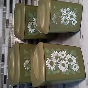 Vintage 1970s green daisy canister set